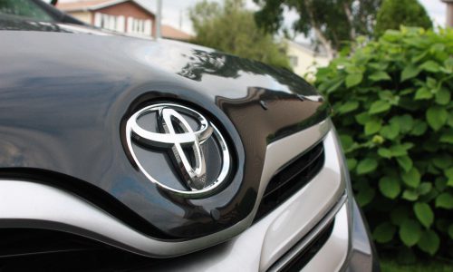 Longueuil, Canada - June 17, 2013: Toyota logo on the hood of a parked Toyota Venza